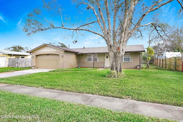 ranch-style home featuring a garage and a front lawn