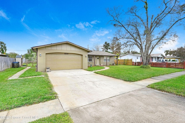 ranch-style home featuring a front lawn and a garage