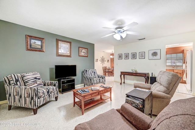 living room featuring ceiling fan