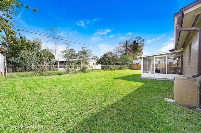 view of yard featuring a sunroom