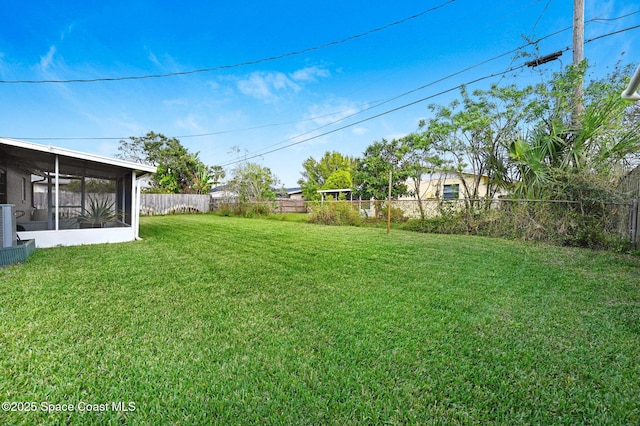 view of yard featuring a sunroom