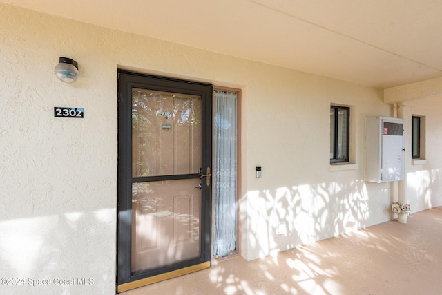 200 S Banana River Blvd Unit 2302, Cocoa Beach, FL 32931 - doorway to property featuring stucco siding
