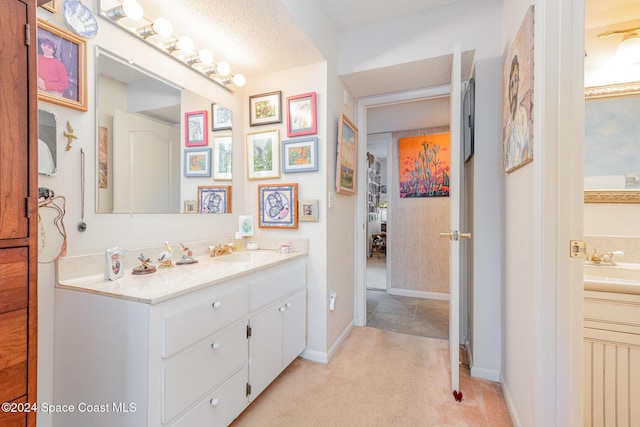 bathroom with vanity and a textured ceiling