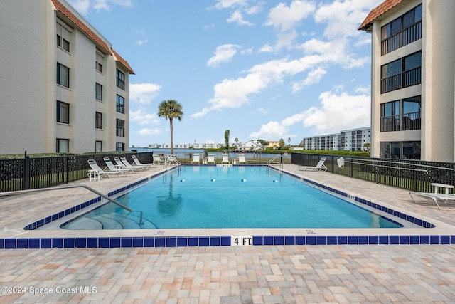 200 S Banana River Blvd Unit 2302, Cocoa Beach, FL 32931 - community pool featuring a patio