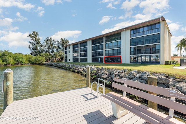 200 S Banana River Blvd Unit 2302, Cocoa Beach, FL 32931 - dock area featuring a water view and a yard