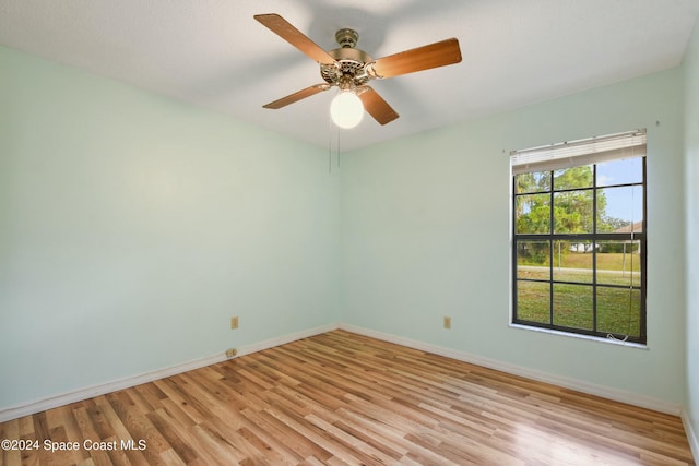 unfurnished room with ceiling fan and light wood-type flooring