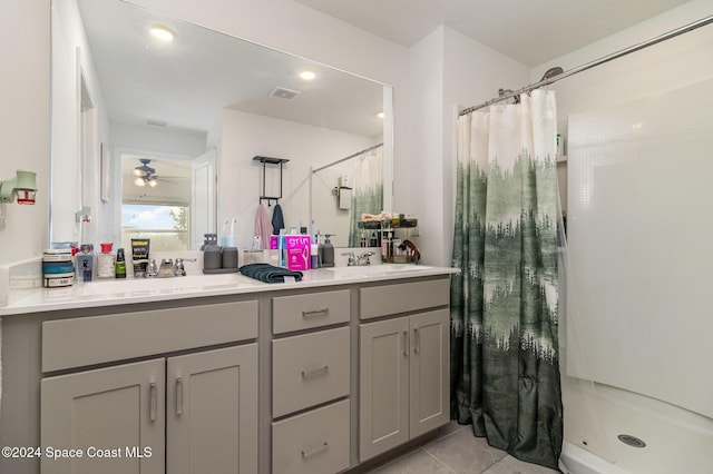 bathroom featuring tile patterned floors, ceiling fan, curtained shower, and vanity