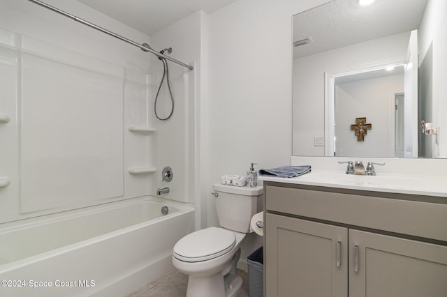 full bathroom with vanity, tile patterned floors, shower / washtub combination, toilet, and a textured ceiling