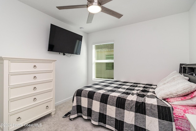 bedroom featuring ceiling fan and light colored carpet