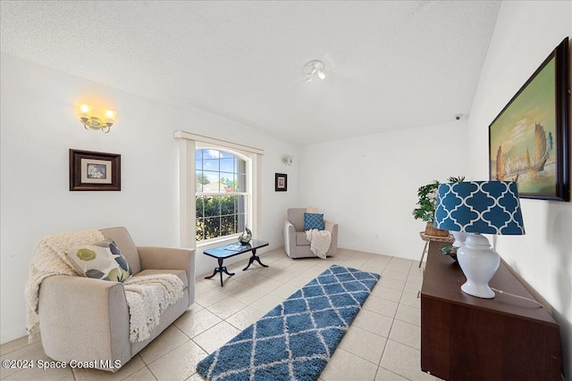 sitting room with light tile patterned flooring and a textured ceiling