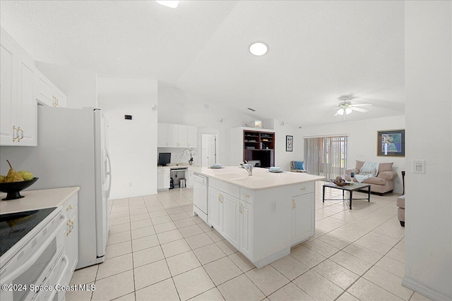 kitchen featuring a center island, white cabinetry, and vaulted ceiling