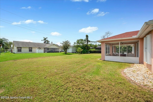 view of yard featuring a sunroom