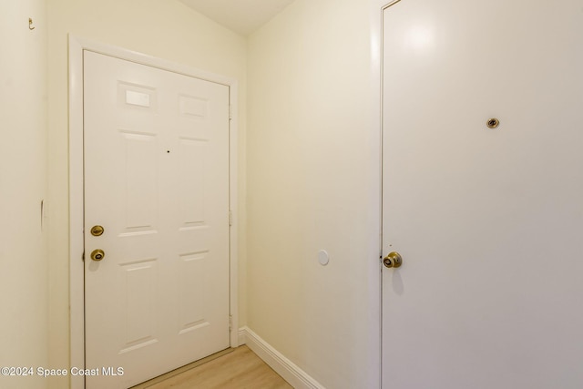 doorway with light wood-type flooring