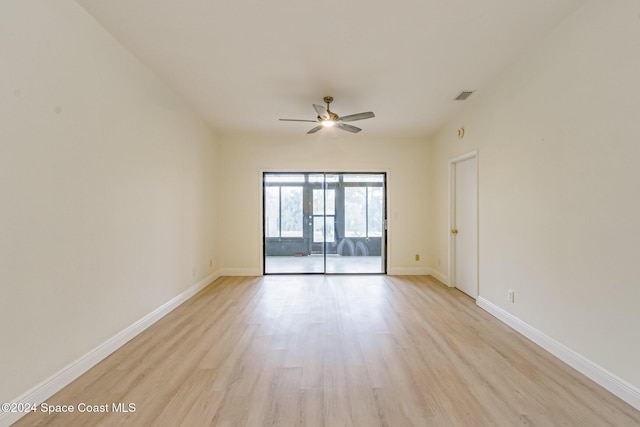 unfurnished room with light wood-type flooring and ceiling fan