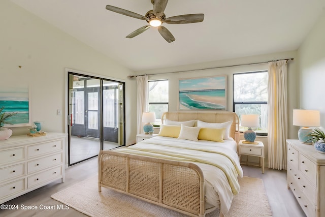 bedroom with ceiling fan, lofted ceiling, access to outside, and multiple windows