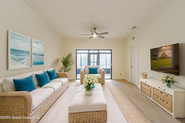 living room featuring light hardwood / wood-style flooring and ceiling fan