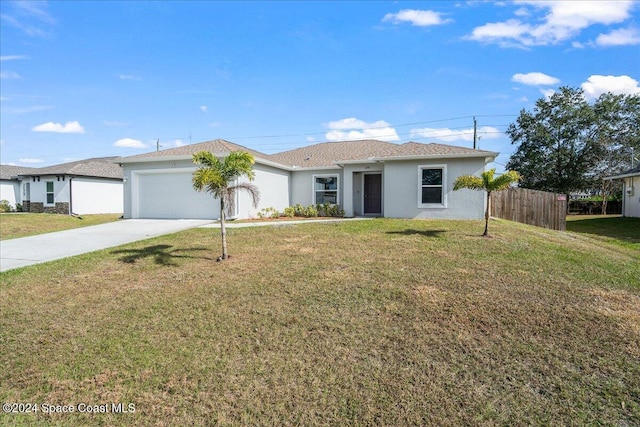 single story home featuring a front yard and a garage