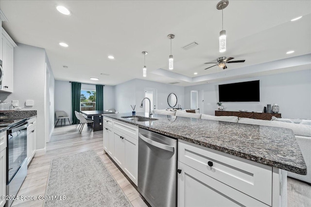 kitchen with black electric range, stainless steel dishwasher, sink, light hardwood / wood-style flooring, and white cabinets