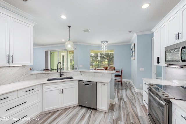 kitchen featuring kitchen peninsula, stainless steel appliances, white cabinetry, and sink