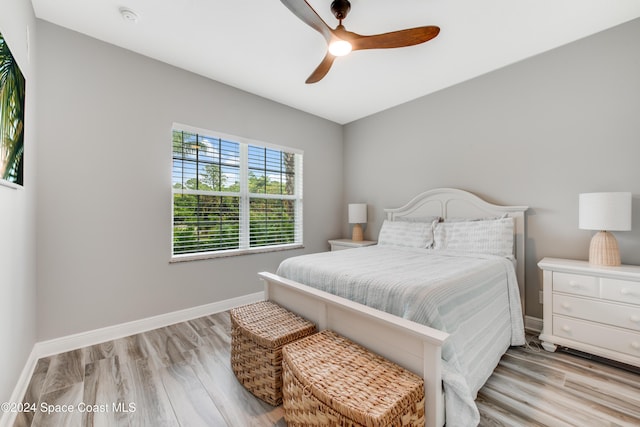 bedroom with light wood-type flooring and ceiling fan