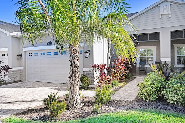 view of front of property with a porch and a garage