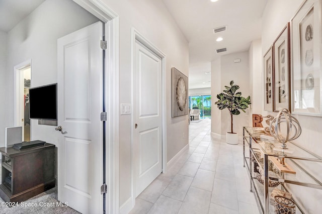 hallway with light tile patterned flooring