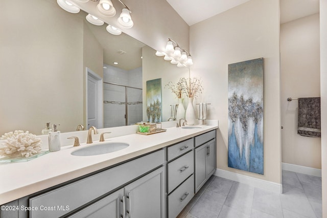 bathroom with vanity, tile patterned floors, and a shower with shower door