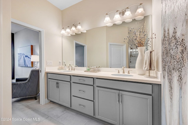 bathroom with tile patterned flooring and vanity