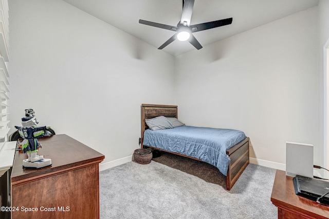 carpeted bedroom with vaulted ceiling and ceiling fan