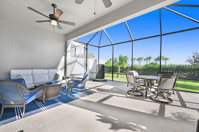 view of patio / terrace with outdoor lounge area, ceiling fan, and a lanai