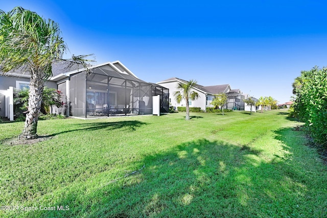 view of yard featuring a lanai