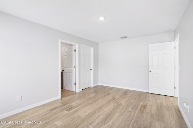 empty room with light wood-type flooring