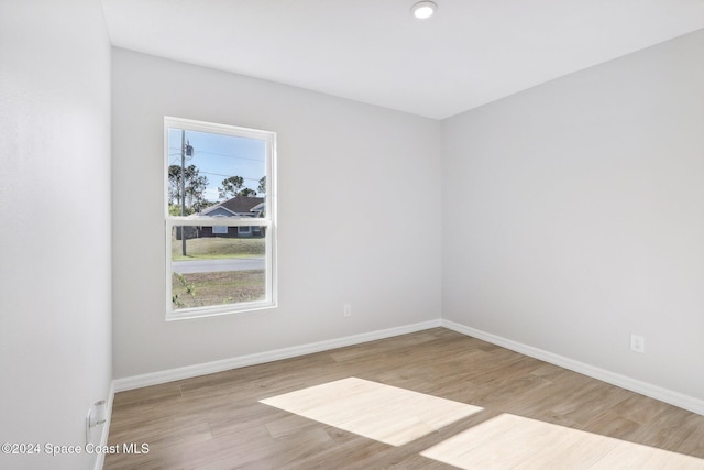 unfurnished room featuring light hardwood / wood-style floors