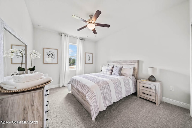 bedroom featuring light carpet and ceiling fan