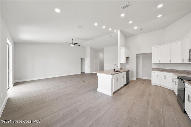 kitchen featuring stainless steel dishwasher, black / electric stove, white cabinets, ceiling fan, and sink