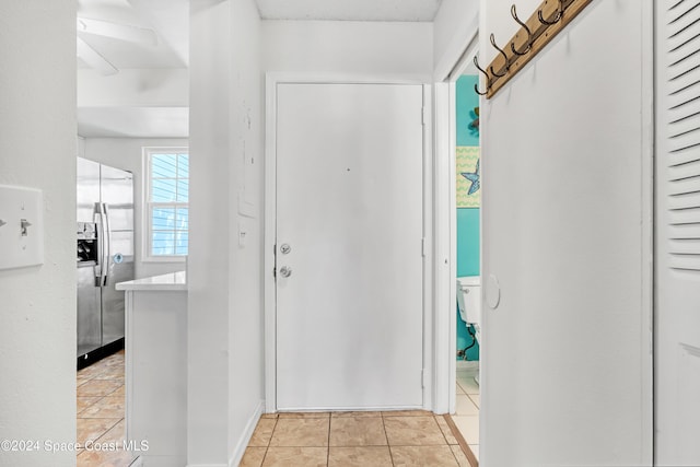 entryway featuring light tile patterned floors