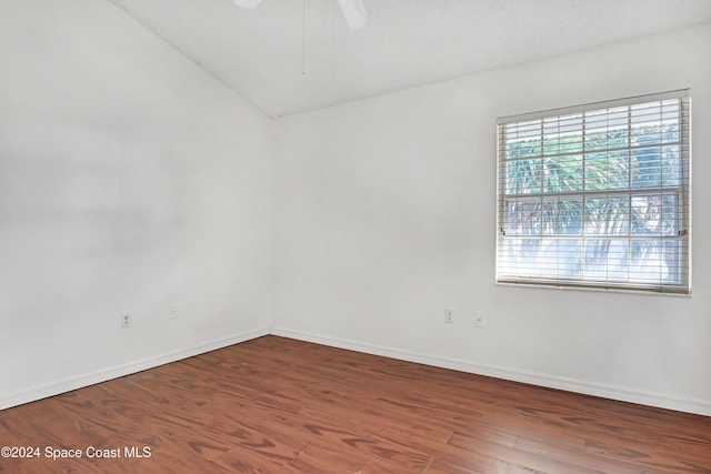 spare room featuring ceiling fan, wood-type flooring, and a textured ceiling