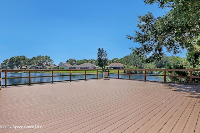 deck featuring a water view