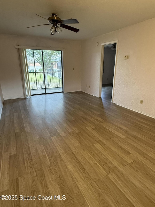 unfurnished room featuring hardwood / wood-style flooring and ceiling fan