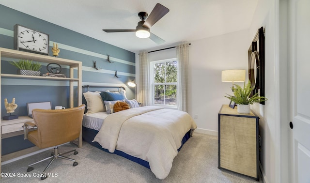 bedroom with ceiling fan and light colored carpet