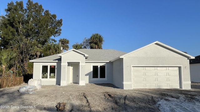 single story home featuring a garage