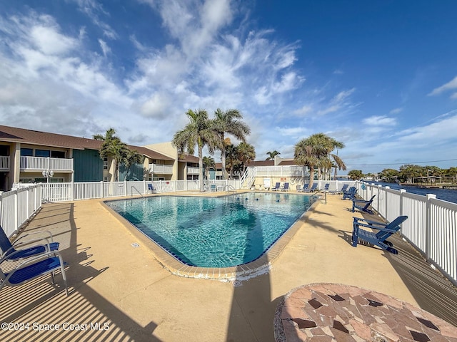 view of swimming pool with a patio