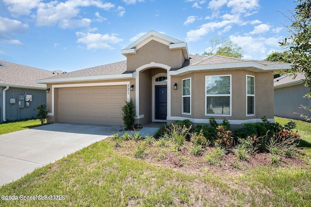 ranch-style home featuring a garage