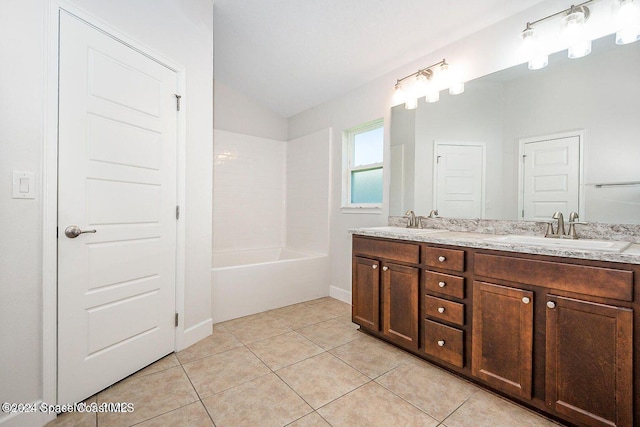 bathroom with tile patterned flooring, vanity, shower / bathtub combination, and lofted ceiling