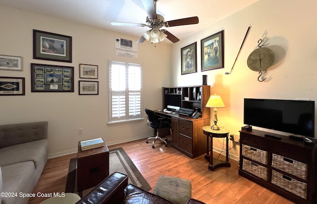 home office featuring light wood-type flooring and ceiling fan