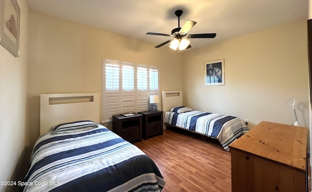 bedroom featuring ceiling fan and wood-type flooring