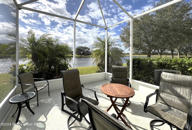 sunroom / solarium with a water view