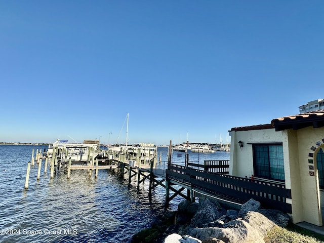 dock area with a water view