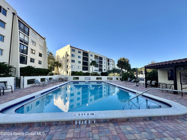 view of swimming pool with a patio area