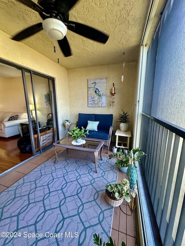 balcony featuring ceiling fan